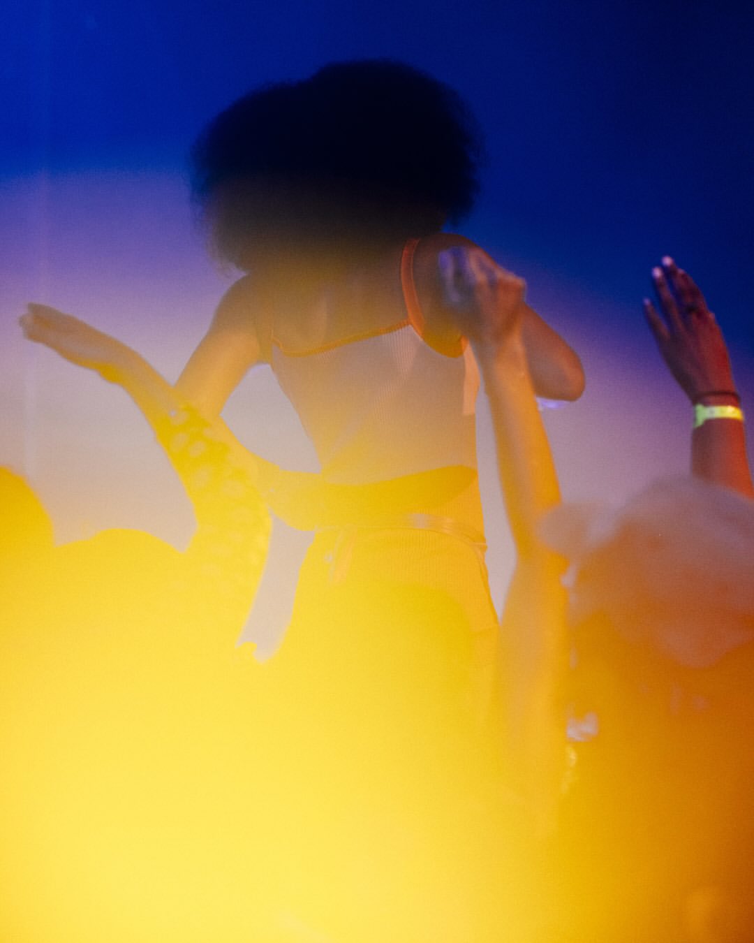 Queen Classic nightlife crowd under blue and yellow light